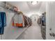 Spacious walk-in closet with custom shelving and ample storage space for clothes and accessories at 1157 Hannaford Ln, Johns Creek, GA 30097