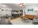 Open concept living space features hardwood floors, a modern kitchen, and comfortable seating at 1157 Hannaford Ln, Johns Creek, GA 30097