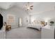 Bright main bedroom with vaulted ceilings, ceiling fan, and large windows, and neutral decor at 1157 Hannaford Ln, Johns Creek, GA 30097