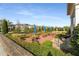 Charming outdoor patio area with tables, umbrellas, and lush greenery at 1157 Hannaford Ln, Johns Creek, GA 30097