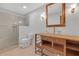 Bathroom featuring walk-in shower with glass door, toilet, and glass bowl sink on wood vanity at 2243 Provence Ne Ct, Marietta, GA 30066