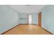Bedroom featuring hardwood floors, light blue walls, recessed lighting, and a brown door at 2243 Provence Ne Ct, Marietta, GA 30066