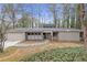 Charming one-story home with a stone walkway, manicured lawn, and a two-car garage at 2243 Provence Ne Ct, Marietta, GA 30066
