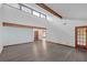 Open-concept living room with soaring ceilings, exposed beams, and hardwood floors at 2243 Provence Ne Ct, Marietta, GA 30066