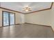 Spacious main bedroom with hardwood floors, a ceiling fan, and a sliding glass door at 2243 Provence Ne Ct, Marietta, GA 30066