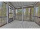 View from screened porch overlooking trees and foliage at 2243 Provence Ne Ct, Marietta, GA 30066