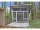 View of screened porch overlooking trees and foliage at 2243 Provence Ne Ct, Marietta, GA 30066