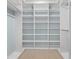 Well-organized walk-in closet with ample shelving, and drawers for optimal storage at 2243 Provence Ne Ct, Marietta, GA 30066