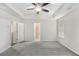 Large main bedroom with a ceiling fan, carpet floors, and access to the main bathroom at 2789 Aralynn Way, College Park, GA 30337