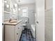 This bathroom features double sinks, a tub, a toilet, and blue tiled floors at 681 Counsel Dr, Marietta, GA 30068
