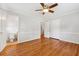 This is a bedroom with hardwood flooring, a ceiling fan, and a walk-in closet at 681 Counsel Dr, Marietta, GA 30068
