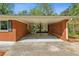 Open carport constructed of brick, offering covered parking, and direct access to the home's entrance at 681 Counsel Dr, Marietta, GA 30068