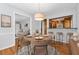 Cozy dining room with pendant lighting and pass-through to the kitchen at 681 Counsel Dr, Marietta, GA 30068
