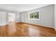 Inviting living room featuring hardwood floors, neutral paint, large window, and modern door frames at 681 Counsel Dr, Marietta, GA 30068