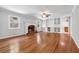 Spacious living room with hardwood floors, a fireplace, built-in shelving, and plenty of natural light at 681 Counsel Dr, Marietta, GA 30068
