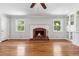 Bright living room features a brick fireplace and built in shelving units at 681 Counsel Dr, Marietta, GA 30068