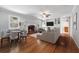 Cozy living room with hardwood floors, fireplace, built-in shelves, and comfortable seating at 681 Counsel Dr, Marietta, GA 30068