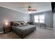 Comfortable bedroom featuring a ceiling fan, carpeted floors, desk, and a mounted flat screen TV at 1123 Seaboard Nw Ave, Atlanta, GA 30318