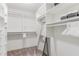 Spacious walk-in closet featuring ample shelving, drawers, and a full-length mirror at 1123 Seaboard Nw Ave, Atlanta, GA 30318