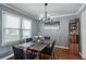 Formal dining room with chandelier lighting, elegant decor, and ample natural light, great for gatherings at 1123 Seaboard Nw Ave, Atlanta, GA 30318
