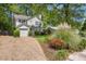 Traditional style home with mature landscaping and attached garage on a sunny day at 1123 Seaboard Nw Ave, Atlanta, GA 30318