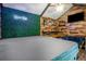 Hot tub with covered top, decorated room, wooden walls, and entertainment area at 1123 Seaboard Nw Ave, Atlanta, GA 30318