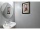 Stylish powder room with modern sink, elegant mirror, and tasteful decor at 1123 Seaboard Nw Ave, Atlanta, GA 30318