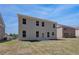 The backyard boasts a well-maintained lawn, a patio, and an easy-to-access back door at 616 Leafy Branch Way, Mcdonough, GA 30253