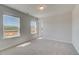 Bright bedroom with large windows offering views of the surrounding landscape at 616 Leafy Branch Way, Mcdonough, GA 30253