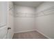 Empty walk-in closet with installed shelving, ready to be organized and filled at 616 Leafy Branch Way, Mcdonough, GA 30253