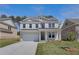 Charming two-story home with white painted brick, complemented by a well-maintained lawn and landscaping at 616 Leafy Branch Way, Mcdonough, GA 30253
