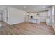Spacious living area flows into a bright kitchen with a center island at 616 Leafy Branch Way, Mcdonough, GA 30253