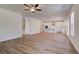 Expansive living area featuring hardwood floors and an open layout to the kitchen at 616 Leafy Branch Way, Mcdonough, GA 30253