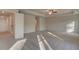 Large main bedroom featuring a tray ceiling, fan, and abundant natural light at 616 Leafy Branch Way, Mcdonough, GA 30253