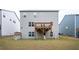 Home exterior featuring a deck overlooking the backyard with a walkout basement at 7586 Jennadee Dr, Fairburn, GA 30213