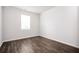 Bright bedroom with wood flooring and a window with natural light at 7586 Jennadee Dr, Fairburn, GA 30213