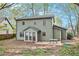 Backyard view of the exterior, patio, and green siding at 835 Ridge Ave, Stone Mountain, GA 30083