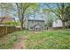 Property showing the exterior, green grass, and mature trees at 835 Ridge Ave, Stone Mountain, GA 30083