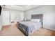 Neutral bedroom with carpet, a gray upholstered bed, and plenty of natural light at 835 Ridge Ave, Stone Mountain, GA 30083