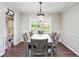 Bright dining room with modern lighting and seating for six at 835 Ridge Ave, Stone Mountain, GA 30083
