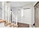 Bright entryway featuring a staircase, unique window, and hardwood floors at 835 Ridge Ave, Stone Mountain, GA 30083