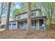 Charming two-story home featuring a covered front porch and a two-car garage at 835 Ridge Ave, Stone Mountain, GA 30083
