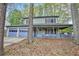 Inviting home with a covered porch and attached two-car garage at 835 Ridge Ave, Stone Mountain, GA 30083
