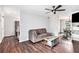 Comfortable living room with hardwood floors and an open layout to the dining space at 835 Ridge Ave, Stone Mountain, GA 30083