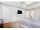 Spacious main bedroom features plush carpeting, tray ceiling, and comfortable furnishings at 835 Ridge Ave, Stone Mountain, GA 30083