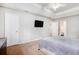 Spacious main bedroom with soft carpet, neutral walls, and tray ceiling at 835 Ridge Ave, Stone Mountain, GA 30083