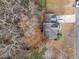 An overhead shot shows the property and surrounding trees at 184 Chamberlyn Ln, Hiram, GA 30141