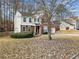 Charming two-story home boasts a brick facade, neutral siding, and a well-maintained front yard at 184 Chamberlyn Ln, Hiram, GA 30141