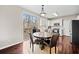 Bright kitchen featuring an eat-in area with a round table and sliding glass door to the backyard deck at 184 Chamberlyn Ln, Hiram, GA 30141