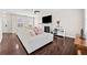 Cozy living room with a fireplace, ceiling fan, hardwood floors, and ample seating at 184 Chamberlyn Ln, Hiram, GA 30141